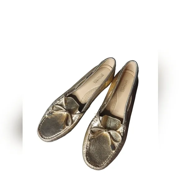 7 Michael Kors gold loafers