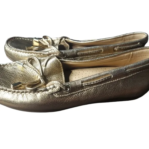 7 Michael Kors gold loafers