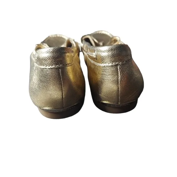 7 Michael Kors gold loafers