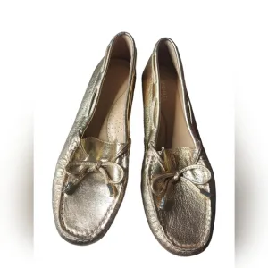 7 Michael Kors gold loafers