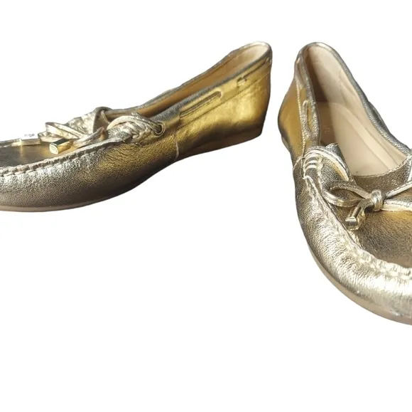 7 Michael Kors gold loafers