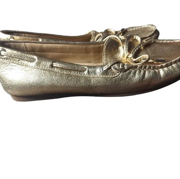 7 Michael Kors gold loafers