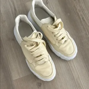 Alexander McQueen Cream and White Sneakers