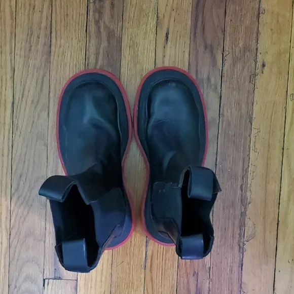 Black Boots with Red Soles