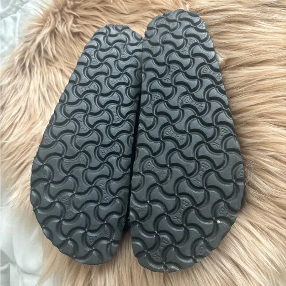 BLACK SUEDE BIRKENSTOCK SHEARLING SANDALS.