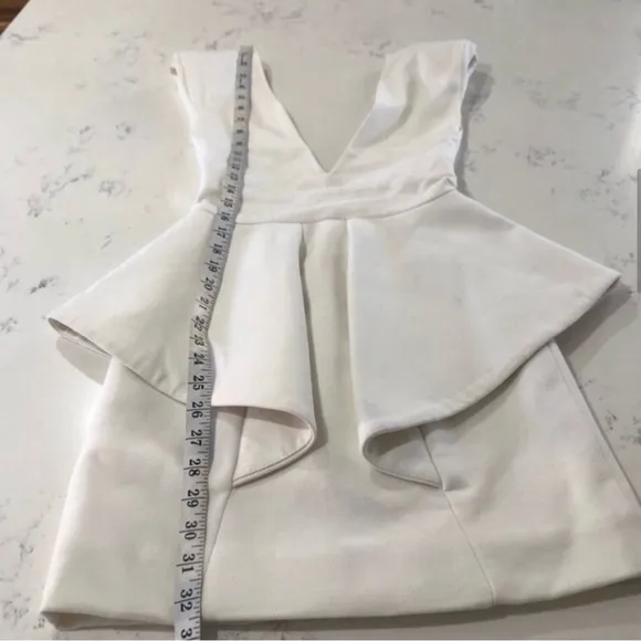 Chloe Sims' Aqua By Aqua Claudia Cream Peplum Waist Dress