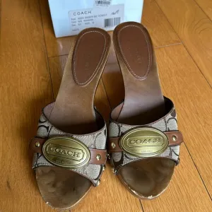 Coach signature sandals.