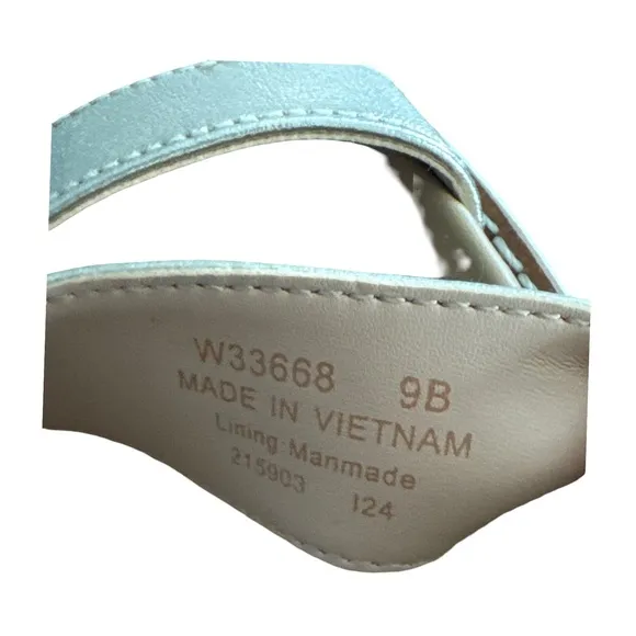 COLE HAAN ORIGINAL GRAND PEYTON FLATFORM SANDALS. SOFT GOLD METALLIC IVORY.