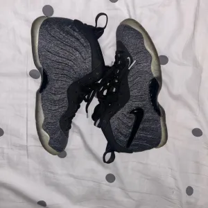 Gray and Black Nike Foamposite Sneakers