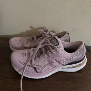 Mauve pink ASICS running shoes
