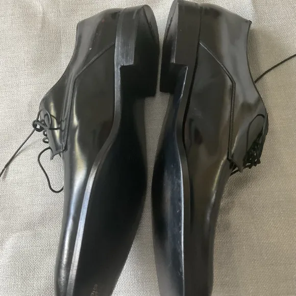 Prada men’s black leather dress shoes,