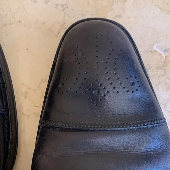 Salvatore Ferragamo black oxfords. Lace up. Detailing on front. Sz 11 1/2.