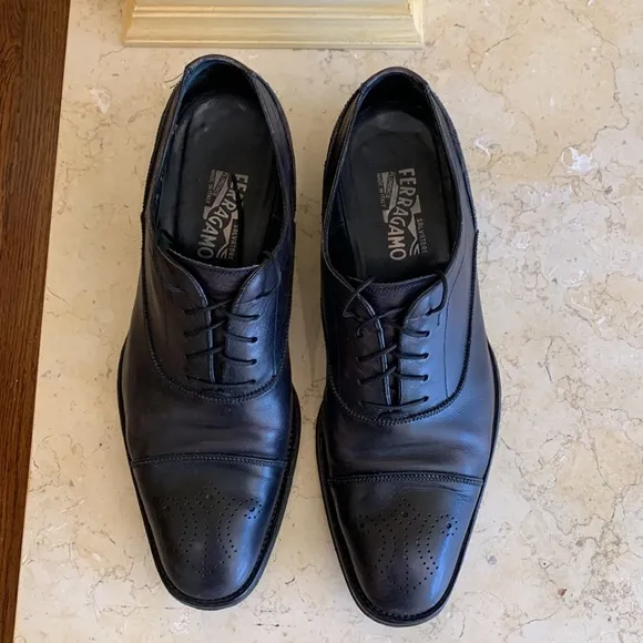 Salvatore Ferragamo black oxfords. Lace up. Detailing on front. Sz 11 1/2.