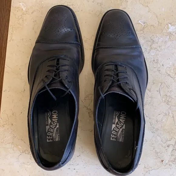 Salvatore Ferragamo black oxfords. Lace up. Detailing on front. Sz 11 1/2.