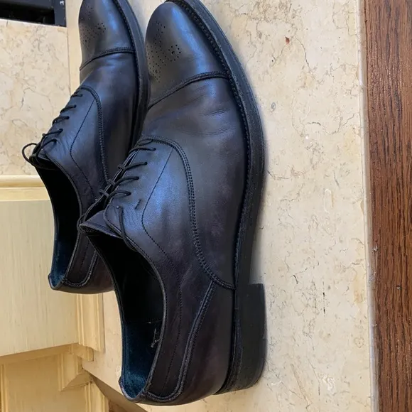Salvatore Ferragamo black oxfords. Lace up. Detailing on front. Sz 11 1/2.