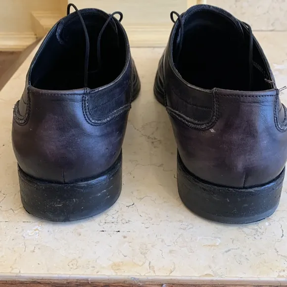 Salvatore Ferragamo black oxfords. Lace up. Detailing on front. Sz 11 1/2.
