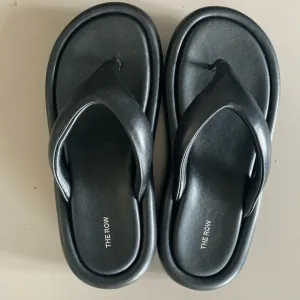 The Row Black Leather Sandals