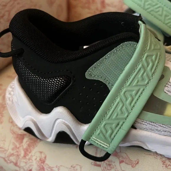 These Nike sneakers were barely worn before out growing.