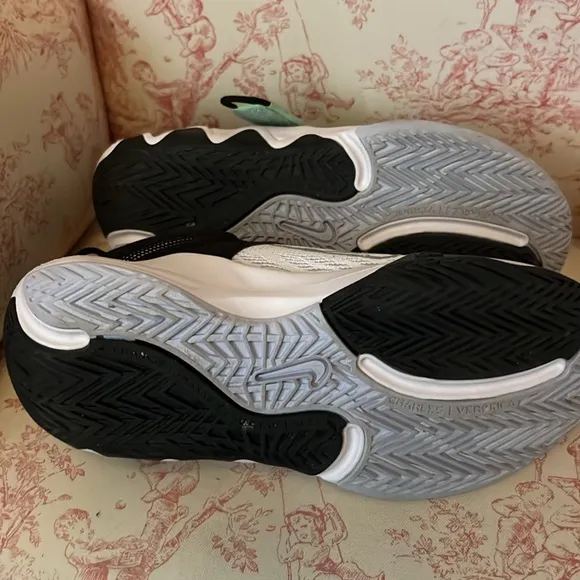 These Nike sneakers were barely worn before out growing.